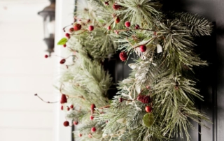 Christmas wreath on front door of custom home