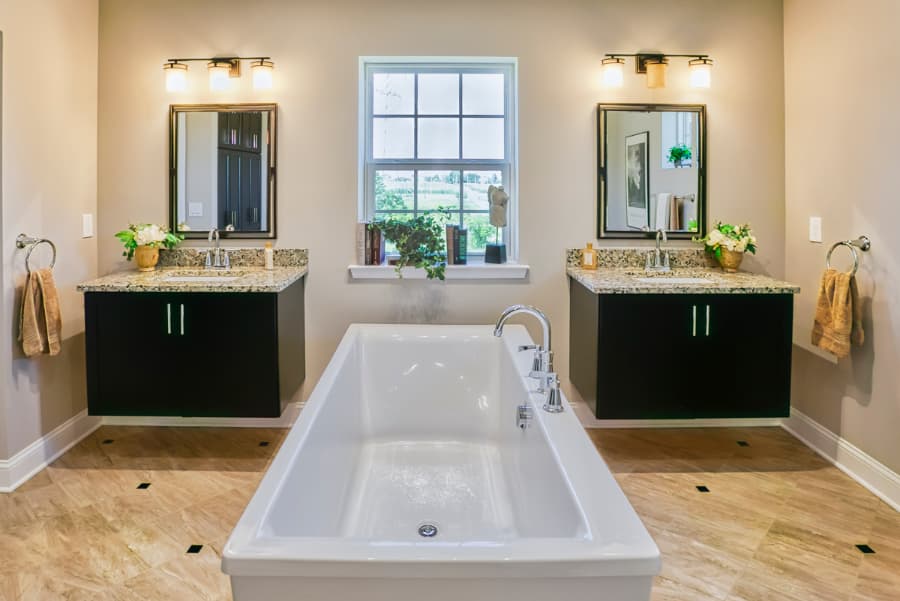 Luxury bathroom customized with central bath and separate floating sink counters